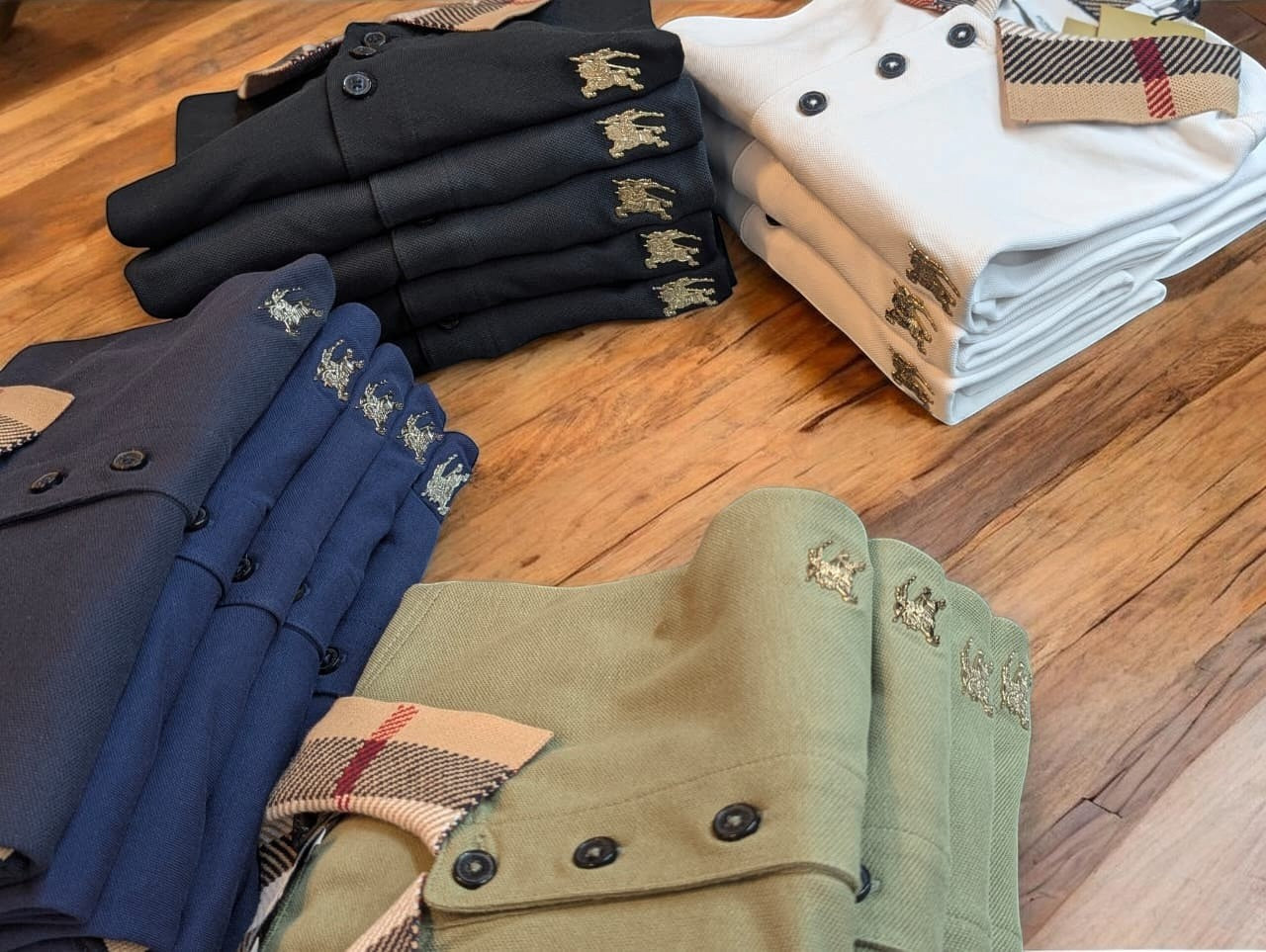 CasualPolo Steel Logo Burberry Polo shirts in black, white, navy, and olive green. Made from 240 GSM combed cotton.